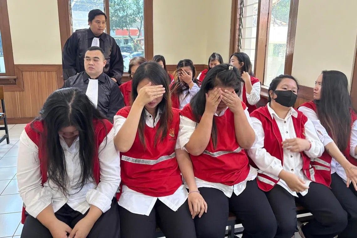 Indonesian court sentences all 19 members of baby-smuggling ring to prison