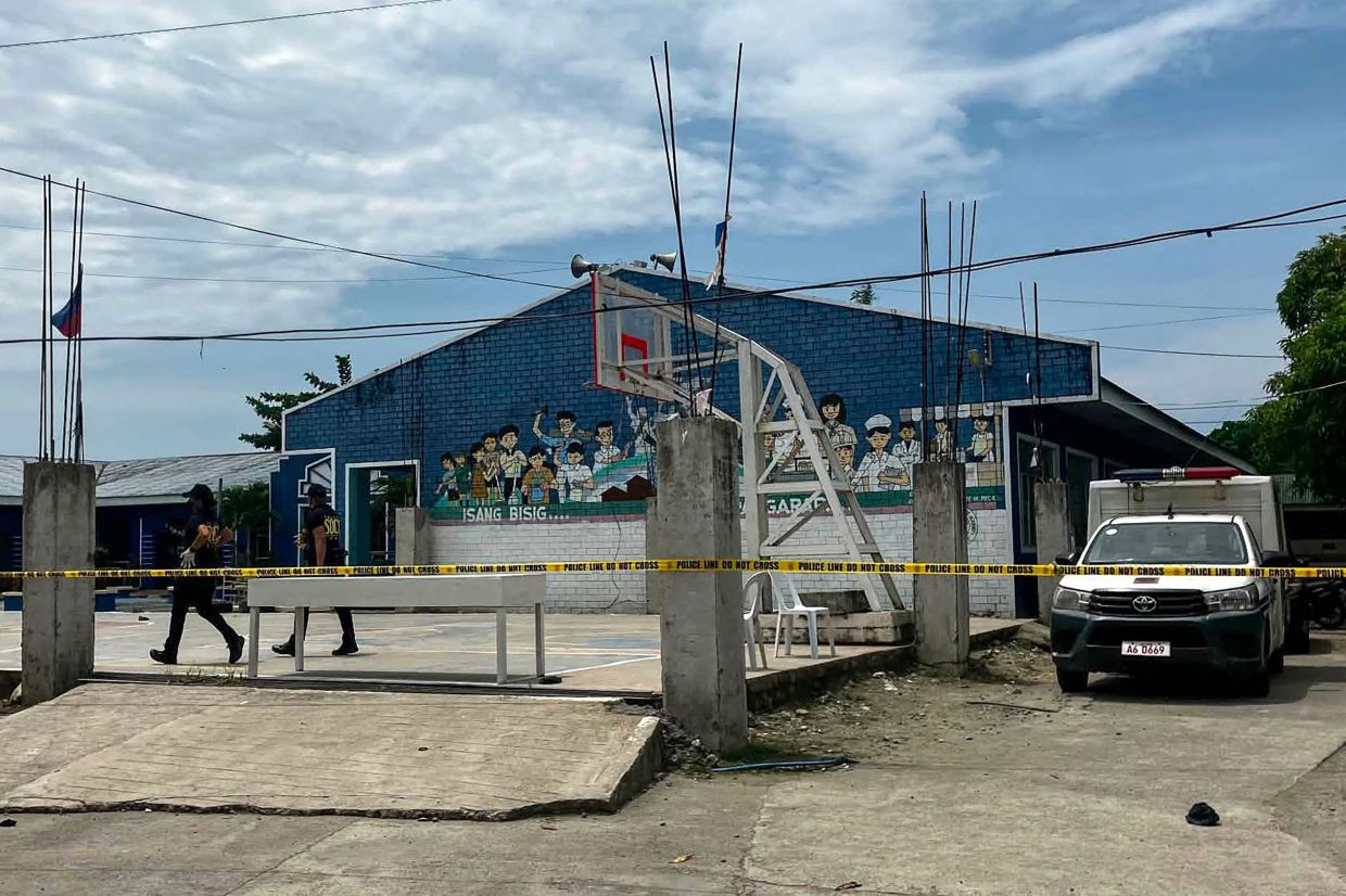 Two teenage students arrested after deadly shooting at Philippine high school kills three