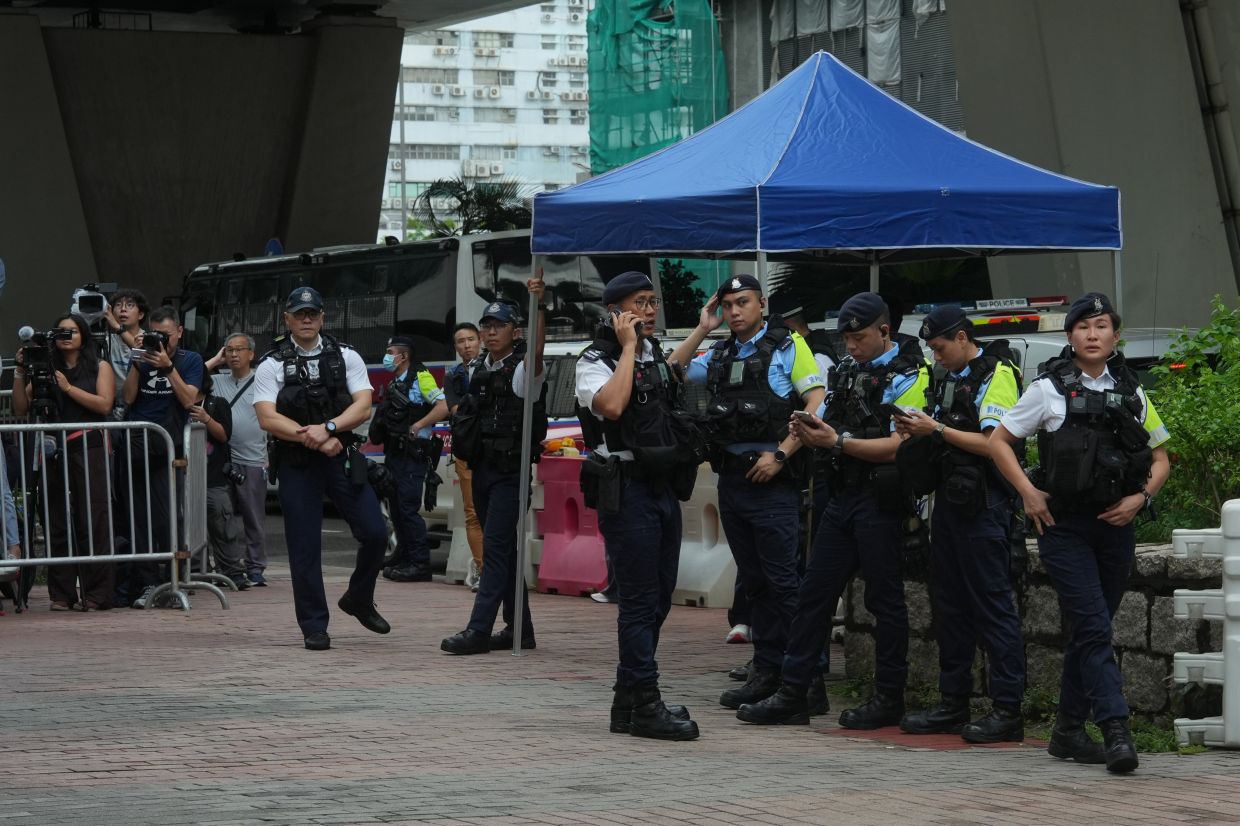 Hong Kong Woman Arrested for T-Shirt Message as Court Delivers Sedition Verdict