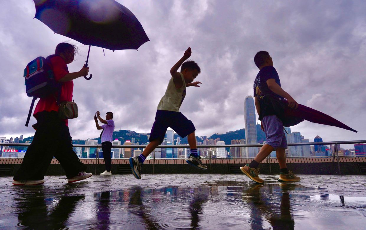 Hong Kong finds respite as heavy rain breaks deadly summer heatwave