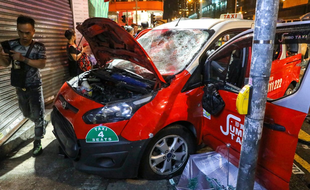 Hong Kong Woman Seeks HK$8.4 Million After Taxi Strikes Her During 2019 Protest
